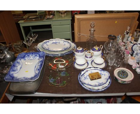 A quantity of gilt decorated tea ware; a decanter and stopper and various table glassware; blue and white serving plates etc.