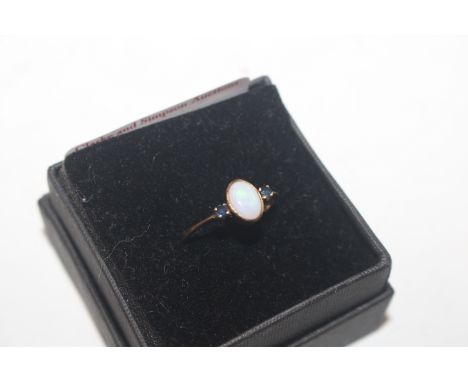 A 9ct gold opal set ring, ring size N/O, approx. total weight 1.2gms 