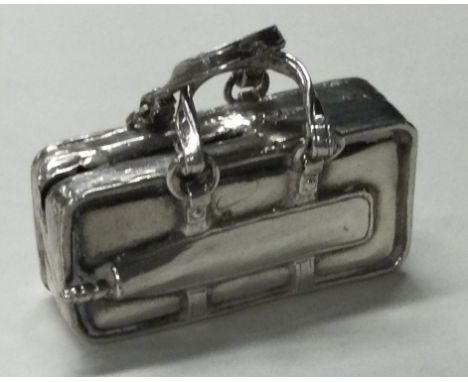 A Sterling silver toy model of a suitcase. Approx. 38 grams. Est. £40 - £60.