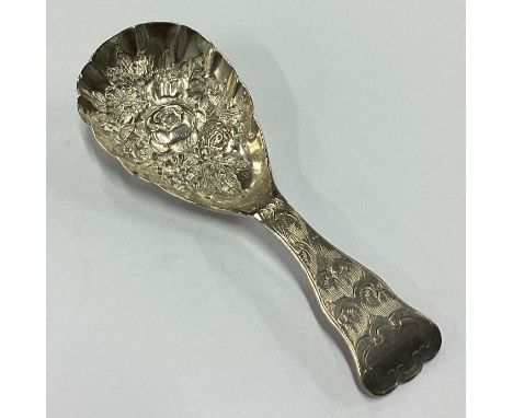 A fine quality Victorian silver caddy spoon embossed with flowers and fine bright-cut decoration to handle. Birmingham 1848. 