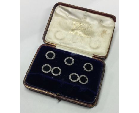 A good boxed set of onyx and diamond circular cufflinks together with matching buttons contained within a fitted box. Approx.