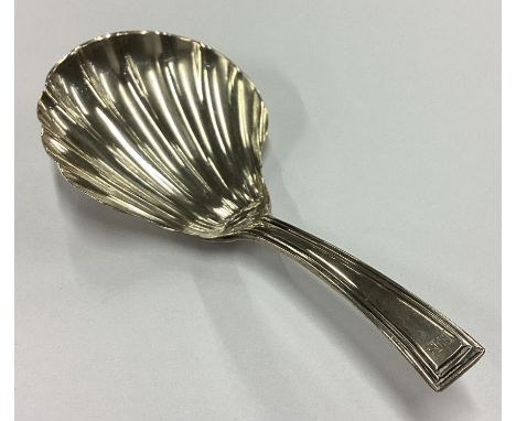 An 18th Century George III silver fluted caddy spoon. London 1799. By Fuller White. Approx. 8 grams. Est. £60 - £80.