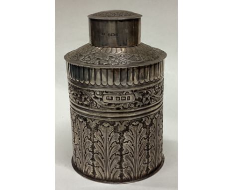 An unusual chased silver tea caddy of cylindrical form. Sheffield. By HA. Approx. 161 grams. Est. £100 - £200.