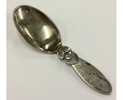 GEORG JENSEN: A silver caddy spoon. Approx. 26 grams. Est. £50 - £80.