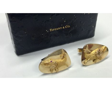 TIFFANY & CO: A good pair of heavy 14 carat gold cufflinks mounted with pikes. Approx. 30 grams. Est. £800 - £1000.
