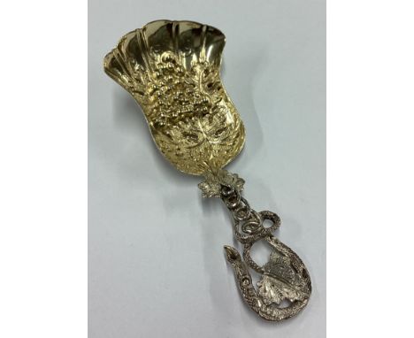 A fine quality Victorian silver caddy spoon of naturalistic form decorated with grapes and vines. Birmingham 1852. By Hilliar
