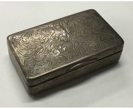 A 19th Century silver hinged snuff box with engraved decoration. Approx. 82 grams. Est. £80 - £120.