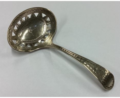 An 18th Century George III bright-cut silver caddy spoon with pierced decoration. London 1794. By GN. Approx. 6 grams. Est. £