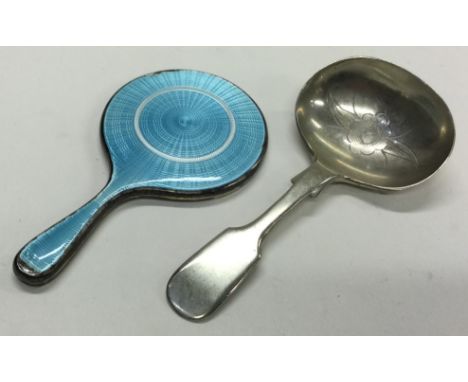 A silver plated caddy spoon together with a silver and enamelled mirror. Est. £20 - £30.