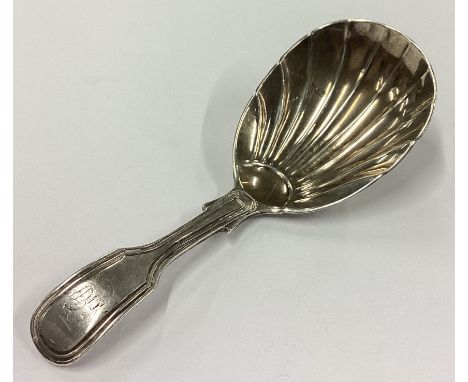 A Victorian silver caddy spoon with fluted bowl. London 1881. By George Adams. Approx. 13 grams. Est. £30 - £50.
