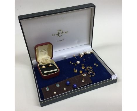 A pair of opal mounted ear studs together with gold and other ear studs. Est. £20 - £30.