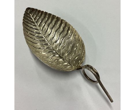 A George III silver chased leaf caddy spoon. Birmingham 1801. By John Taylor. Approx. 7 grams. Est. £80 - £120.