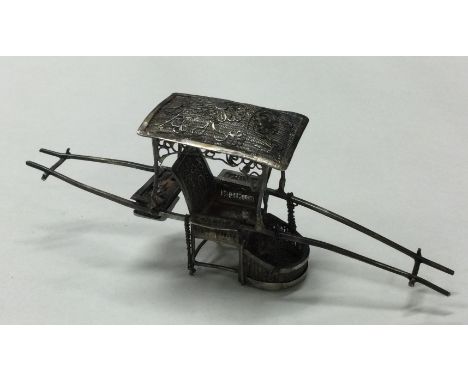 A 19th Century Chinese silver model of a sedan chair. Signed verso. Approx. 19 grams. Est. £30 - £50.