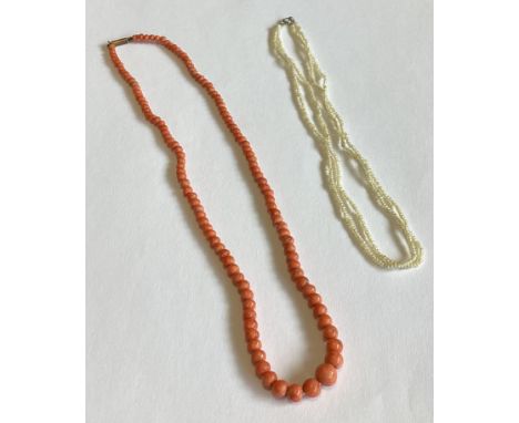 A coral necklace together with a seed pearl example. Approx. 17 grams. Est. £30 - £50.