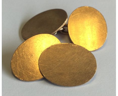 A good pair of 9 carat cufflinks of oval form. Approx. 10 grams. Est. £150 - £200.