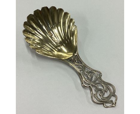 A good Victorian silver fluted caddy spoon with pierced handle. Birmingham 1853. By Hilliard &Thomason. Approx. 12 grams. Est