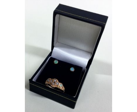 An attractive opal six stone ring together with a pair of studs. Approx. 3 grams. Est. £50 - £80.