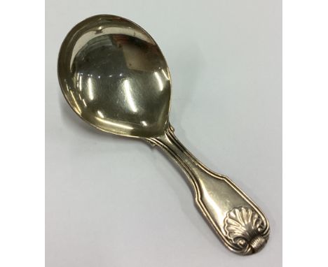A George III silver shell back caddy spoon. London 1821. By William Eley. Approx. 13 grams. Est. £50 - £80.