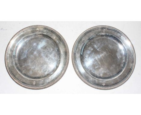 A pair of George III silver dinner plates by Paul Storr (1770-1844), each of typical plain dished form, with gadrooned edges,