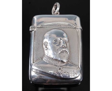 An Edwardian silver vesta to commemorate the coronation of King Edward VII, of hinged rectangular form, relief decorated with