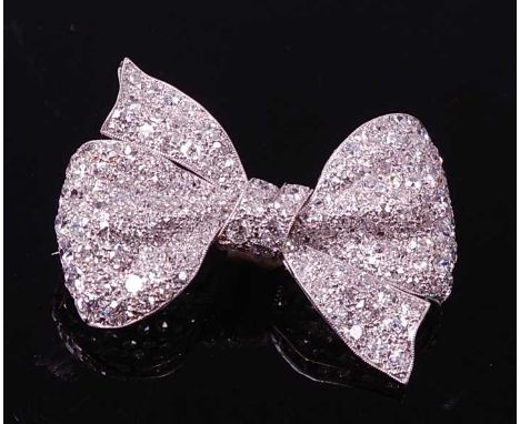 An early 20th century white metal diamond bow brooch, comprising 166 Old European and rose cut diamonds (one deficient) in pa