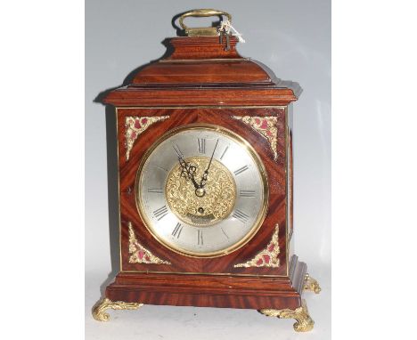 A mahogany and gilt metal mounted bracket clock, 18th century and later, the ogee moulded caddy top with brass swing carry ha