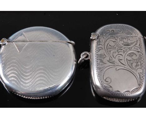 A George V silver vesta, of flattened circular form, having swirling engine turned decoration, maker William Hare Haseler, Bi