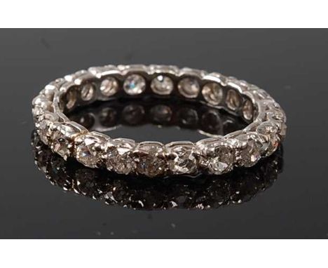 A white metal diamond full hoop eternity ring, with twenty-two Old European cut diamonds in scalloped claw settings, diamond 