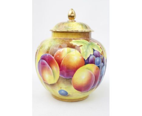 A Royal Worcester painted fruit ginger jar and cover decorated with peaches and grapes, 18cm high, signed Leaman for the arti