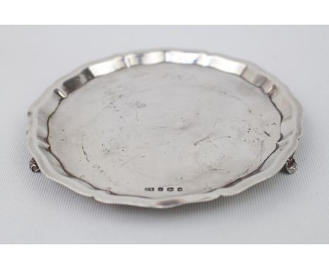20thC Silver Circular salver on scroll bracket feet. Birmingham 1960 By Viners Limited. 14.5cm in Diameter. 139g total weight