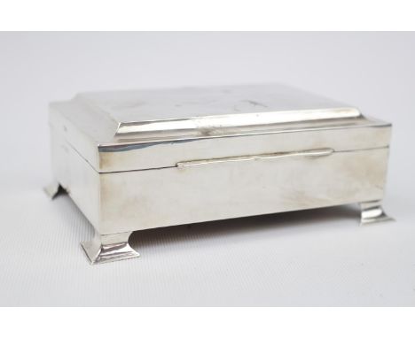 Art Deco Silver Cedar lined Cigarette box on four splayed bracket feet. Birmingham 1930. 14.5cm in Length. 454g total weight 