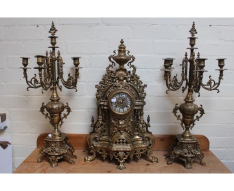 Very Ornate Rococo style Brass mantel clock with roman numeral dial and matching 5 branch candelabras. 68cm in Height 
