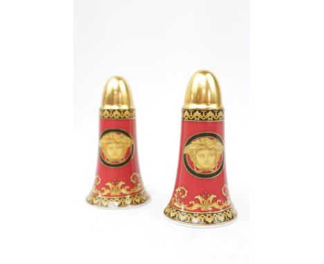 Versace Rosenthal ceramic salt and pepper pots with gilded tops and Medusa head decoration.