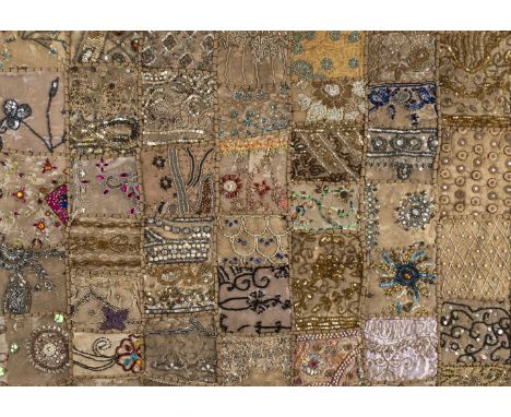 * Embroidery. A large beaded Indian-style panel, circa 1960s, decorative fabric panel, composed of numerous different irregul