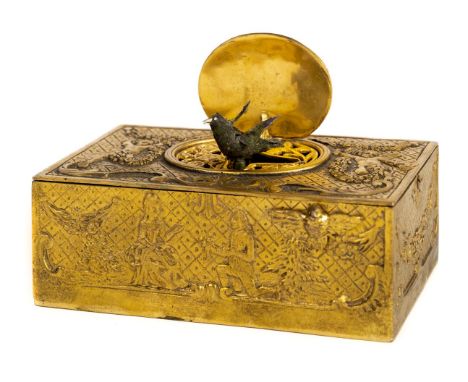 * Automaton . A 20th century French brass automaton bird musical box, the brass box cast with cherubs and musical instruments