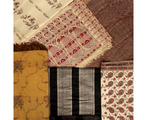 * Shawls. A large Norwich shawl, circa 1820s, cream shawl, with narrow woven border of small boteh motifs to long sides, and 