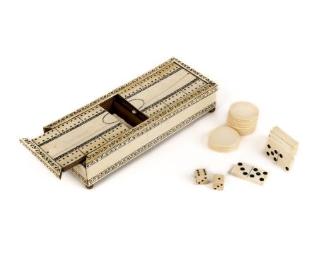 * Anglo Indian. A Vizagapatam ivory games box c.1820, the rectangular box with two sliding cribbage board lids, enclosing 28 