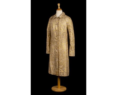 * Dimitri Kritsas . A ladies' brocade coat, circa 1960s, tailored gold and cream brocade evening coat, with shirt collar, lon