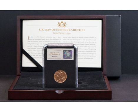 A United Kingdom Queen Elizabeth II 1957 gold full sovereign coin, slab mounted within display box and complete with COA. 