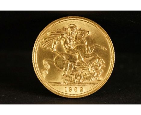 A United Kingdom Queen Elizabeth II gold full sovereign coin dated 1962. 