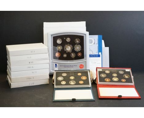 A collection of Royal Mint United Kingdom Brilliant Uncirculated coin year sets to include 1997, 1995, 1984, 1986, 1988, 1989