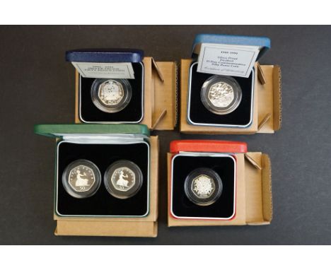 A collection of four Royal Mint United Kingdom silver proof 50p  / fifty pence coins to include 1998 25th Anniversary of the 