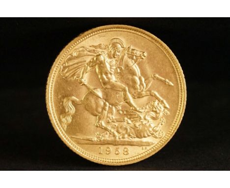 A United Kingdom Queen Elizabeth II gold full sovereign coin dated 1958. 