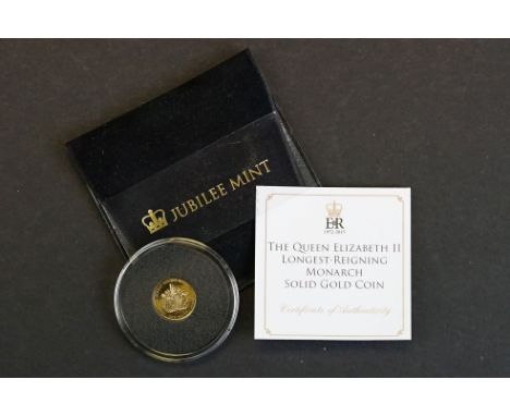 A Queen Elizabeth II longest reigning monarch solid gold one crown coin. 