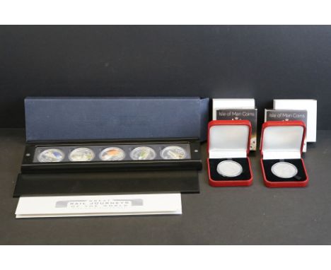 A Perth Mint Great Rail Journeys of the World silver five coin set together with an Isle of Man Pomp &amp; Circumstance Crown