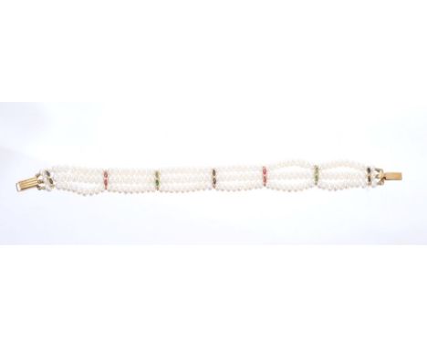 Freshwater cultured pearl three-strand bracelet with emerald, ruby and sapphire spacers on 18ct gold clasp. 19cm