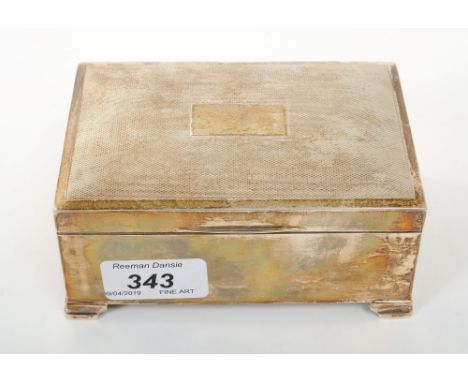 Contemporary silver cigarette box of rectangular form, hinged cover with engine-turned decoration and cedar lining, on four b