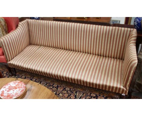 Late Regency upholstered sofa of square form, with striped upholstery on turned legs and castors, 189cm wide