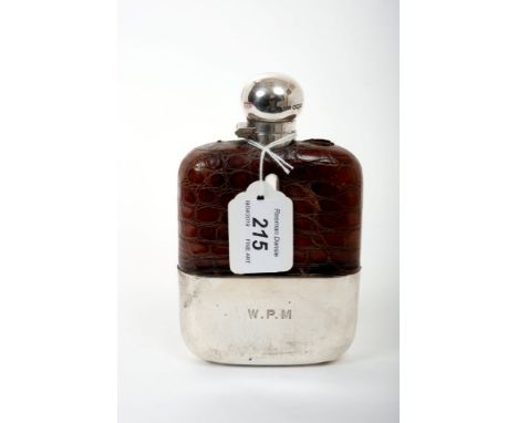 1920s glass spirit flask with crocodile leather cover and hinged silver cover with bayonet fastening, detachable silver drink