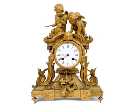 19th century French gilt metal mantel clock with white enamel dial, ornate case with two Cupid mounts, doves, chains and swag